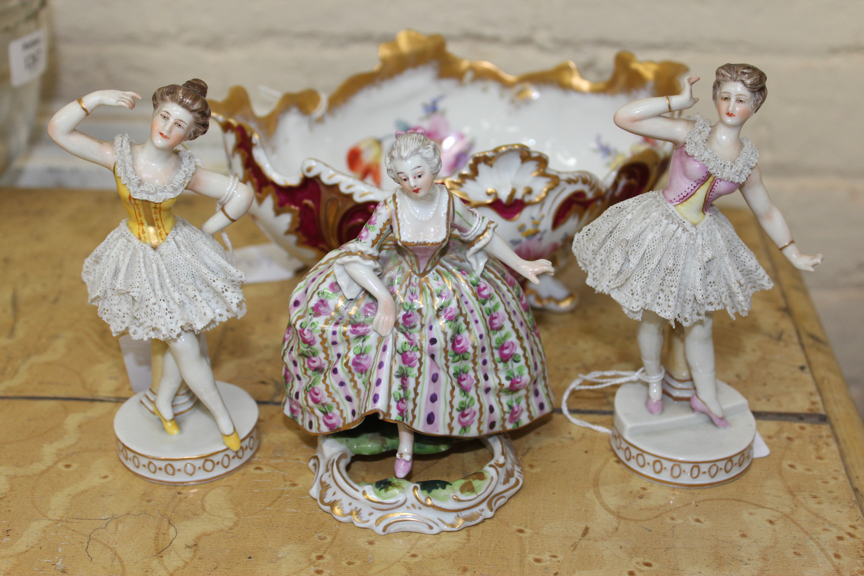 A Royale Nymphenburg porcelain basket painted with panels of flowering foliage in colours within