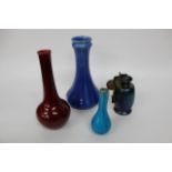 A ROYAL LANCASTRIAN BLUE GLAZED CASE, 28cm high, a further red glazed bottle vase, and Austrian