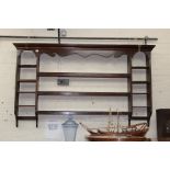 A 19TH CENTURY OAK PLATE RACK the central section of three shelves flanked on either side by further