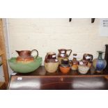 A LARGE 19TH CENTURY STONEWARE HARVEST JUG with looped handle and sprig decoration of a hunting