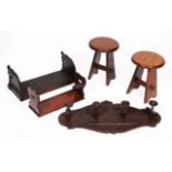A PAIR OF SMALL WALNUT STOOLS together with a book slide, further Indian book slides, a carved oak