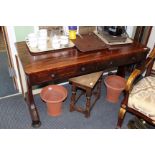 A MID 19TH CENTURY ROSEWOOD SOFA TABLE with two frieze drawers and standing on shaped supports to