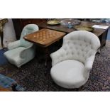 A VICTORIAN BUTTON UPHOLSTERED TUB ARMCHAIR standing on carved mahogany feet terminating in