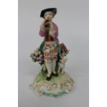 AN ANTIQUE SOFT PASTE PORCELAIN, POSSIBLY DERBY, FIGURE OF A GENTLEMAN PLAYING A PIPE with his dog