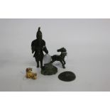 A SMALL NETSKI IN THE FORM OF A DOG OF FAUX together with a hardstone figure of an Oriental