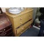 A LATE VICTORIAN PAINTED PINE CHEST of two short and three long drawers with turned knob handles and