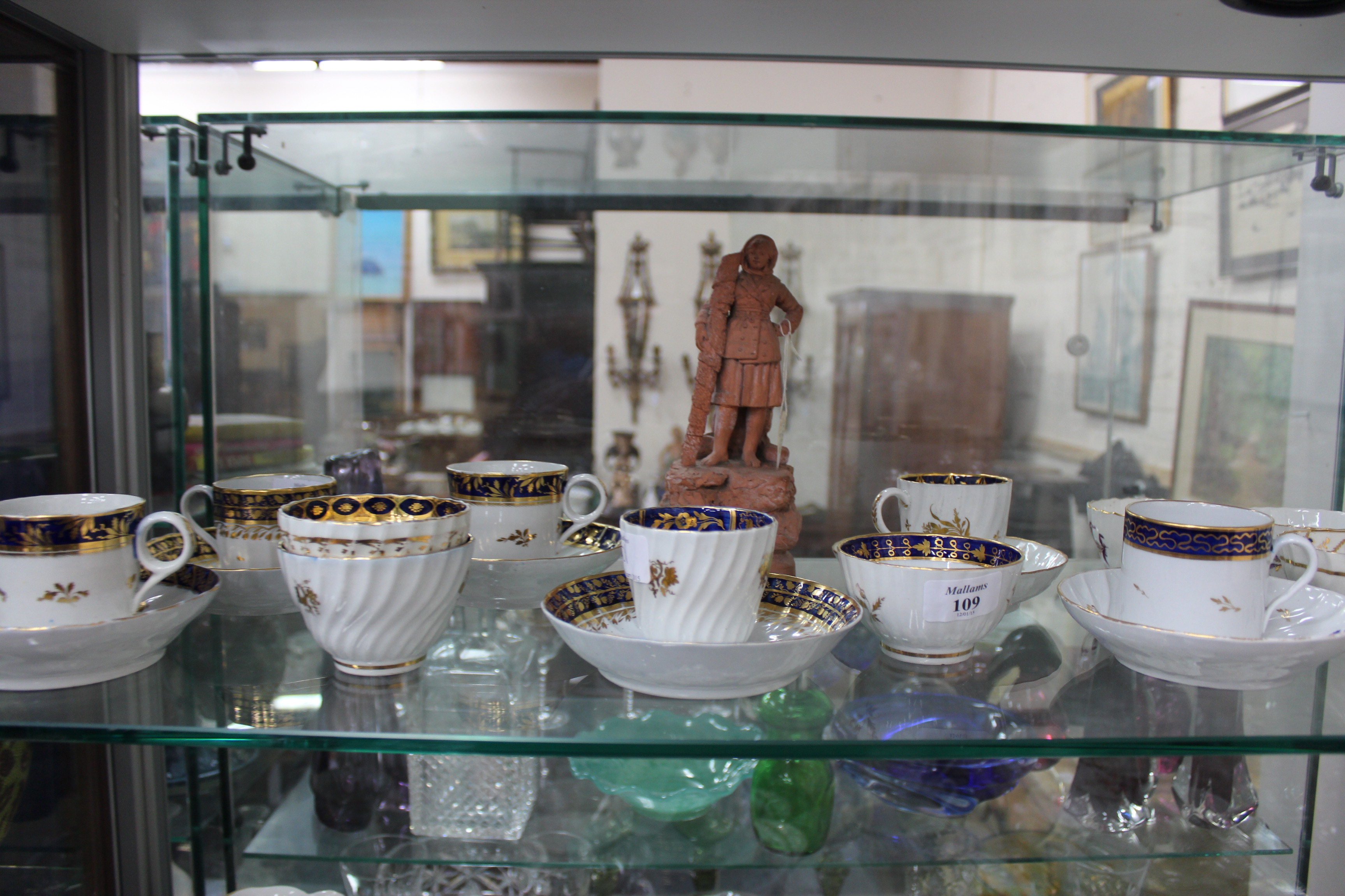 A COLLECTION OF ANTIQUE ENGLISH PORCELAIN TEA BOWLS AND COFFEE CANS all with varying blue and gilded