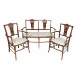 AN EDWARDIAN MAHOGANY AND INLAID SALON SUITE with small chair back sofa and two matching