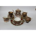 A ROYAL CROWN DERBY OLD IMARI PATTERN TEA SET consisting of a teapot, milk jug, sugar bowl, six