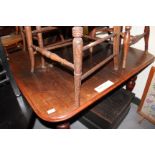 A VICTORIAN MAHOGANY DRAWER LEAF DINING TABLE with bobbin turned legs terminating in brass and