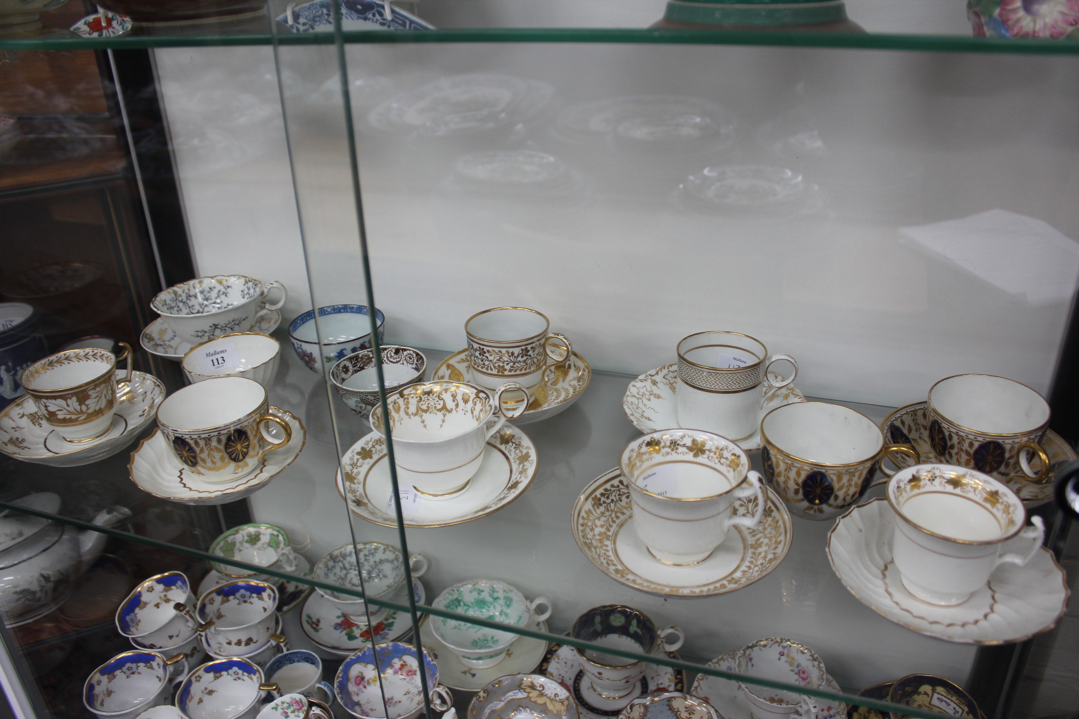 A COLLECTION OF ANTIQUE PORCELAIN TEACUPS and saucers