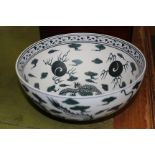 A CHINESE BISQUE PORCELAIN BOWL decorated with dragons chasing flaming pearls, 24.5cm wide