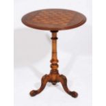 A VICTORIAN WALNUT CIRCULAR CHESS TABLE with floral inlay to the top on turned column support and