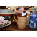 A 1960 BLUE AND WHITE TRANSFER PRINTED PINT TANKARD decorated with scenes of a house and church