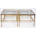 A PAIR OF RECTANGULAR BRASS OCCASIONAL TABLES standing on fluted legs united by an undertier beneath