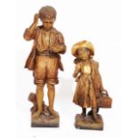 A LATE 19TH CENTURY GOLDSCHEIDER POTTERY AND PAINTED FIGURE of a boy in bare feet standing over a