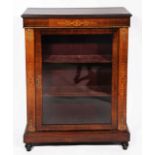 A VICTORIAN WALNUT PIER CABINET with single glazed door enclosing velvet lined shelves within and