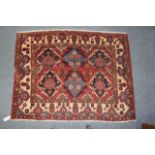 A CREAM GROUND BELOUCHE RUG the multiple foliate medallions within a banded border 150 x 118cm