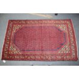 A BLUE GROUND ARAK RUG  the dense foliate field within a multiple banded border 200 x 120cm
