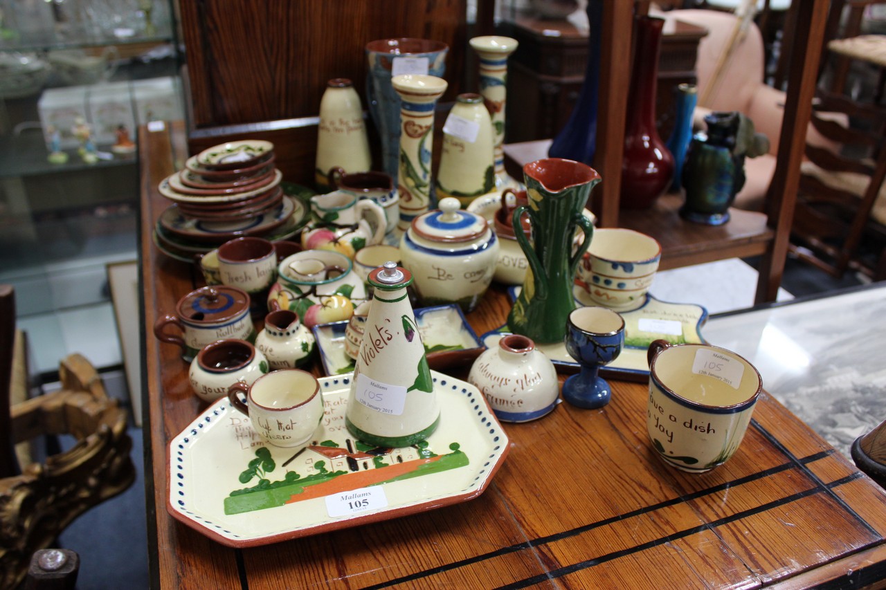 A COLLECTION OF WATCOMBE MOTTO WARE POTTERY to include jugs, mugs, vases, etc.