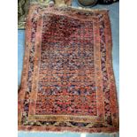 A PERSIAN BLUE GROUND RUG with central floral field within a triple banded border, 147cm x 107cm