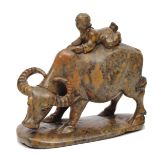 AN ORIENTAL SOAPSTONE CARVING of a boy on the back of a water buffalo, 13.5cm high