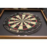 A WINMAU BRITISH DARTS ORGANISATION DART BOARD in cabinet