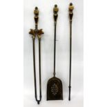 A SET OF THREE EDWARDIAN BRASS FIRE IRONS with pierced shovel, poker and tongs all with cubic