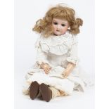 AN ANTIQUE BISQUE HEADED DOLL by Armand Marseille, the shoulders stamped '370, AM-4-DEP' with kid