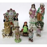 THREE STAFFORDSHIRE FIGURINES to include one of two minstrels together with a Doulton figure of