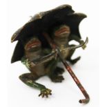 A COLD CAST BRONZE, two frogs under an umbrella, 3cm in height