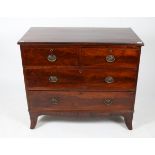 A 19TH CENTURY MAHOGANY CHEST of two short and two long drawers standing on outswept bracket feet,
