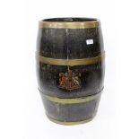 AN OAK OVAL BRASS BOUND COOPERED STICK STAND with applied Royal Coat of Arms, 60cm high and with