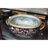 A 20TH CENTURY CHINESE PORCELAIN FOOT BATH with character mark to the base 36cm wide together with a