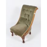 A VICTORIAN MAHOGANY BUTTON BACKED SLIPPER CHAIR with scroll carved frame and cabriole legs, 53cm