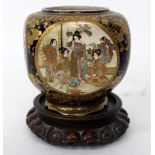 A JAPANESE SATSUMA WARE VASE, the four sides each with a circular vignette of figures in a house and