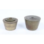 AN ANTIQUE BRASS SET OF EIGHT CUPPED TROY OZ WEIGHTS, from 20oz to 1/4oz, the largest 7.5cm