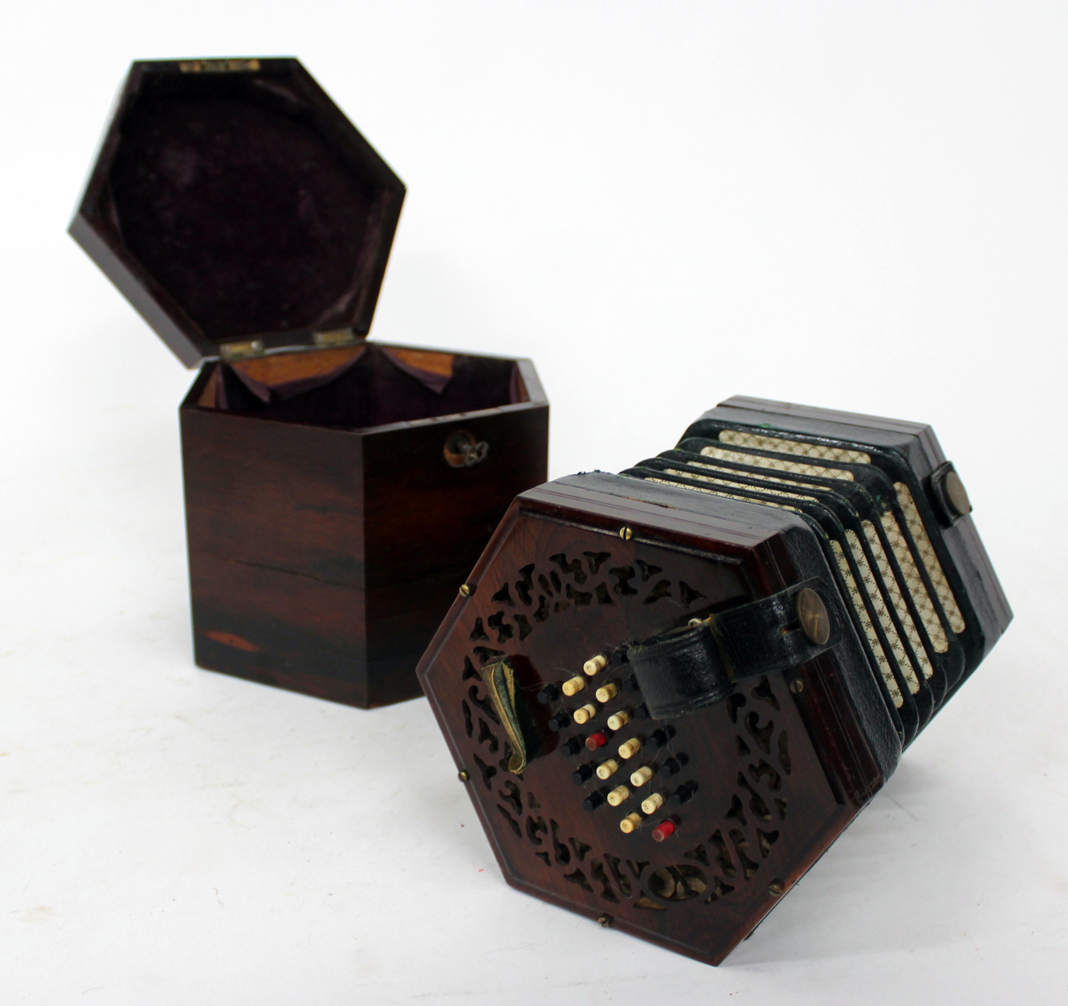 AN ANTIQUE, POSSIBLY 19TH CENTURY ROSEWOOD 48 BUTTON CONCERTINA with decoratively pierced end