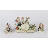 A CONTINENTAL PORCELAIN GROUP of a girl and a boy in a pastoral scene mounted on an oval base with