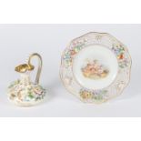 A ROSENTHAL CABINET PLATE the pierced diaper and flower decorated rim surrounding a central scene,