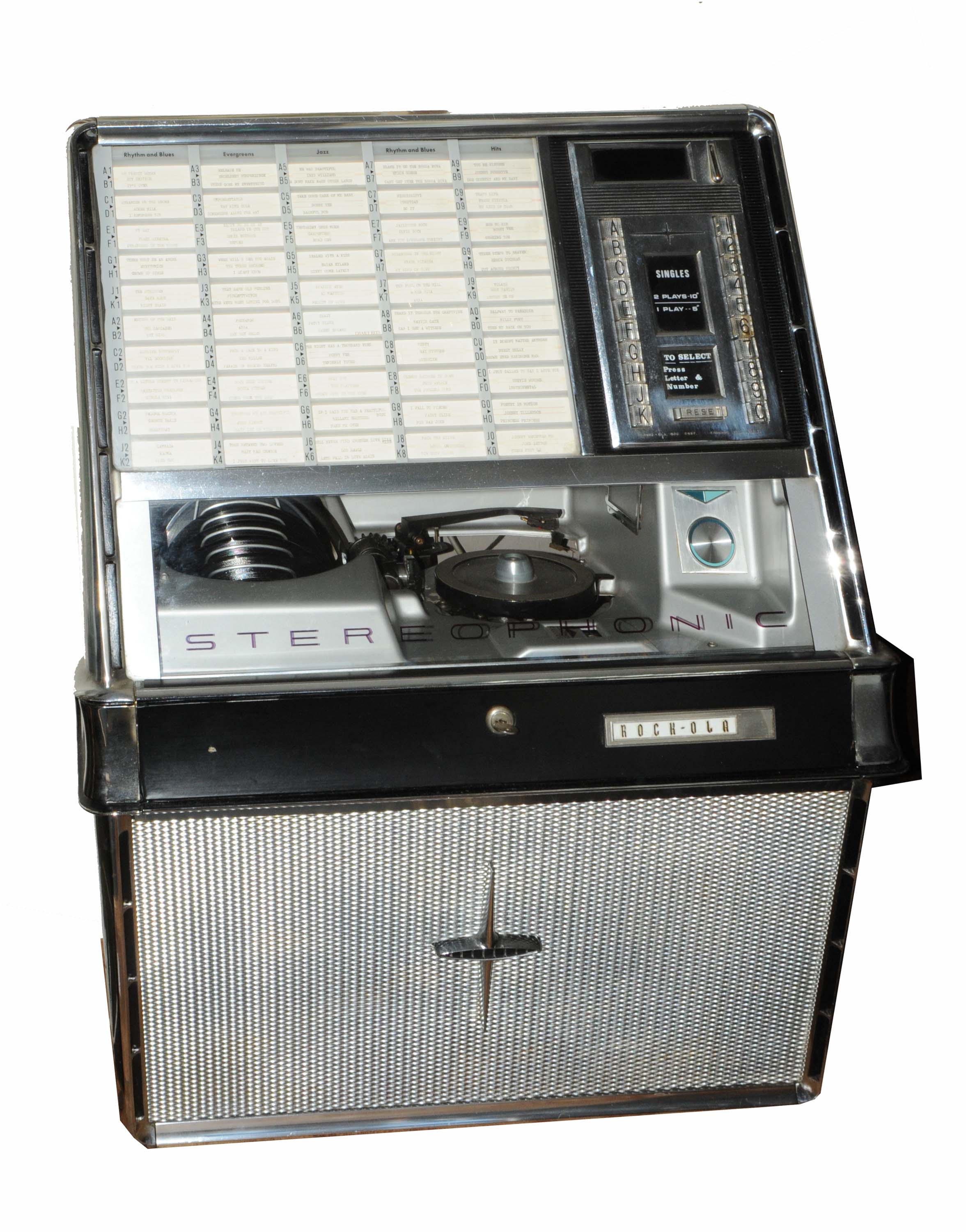 A ROCK-OLA 430 STEREOPHONIC JUKE BOX holding fifty singles and standing on original chromium