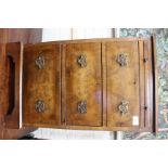 A SMALL WALNUT CHEST with slide over three drawers and on bracket feet, 46cm wide x 76cm high