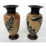 A PAIR OF VICTORIAN DOULTON STONEWARE VASES with foliate decoration, signed FcR and with impressed