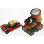 A PRE WAR TIN PLATE PAINTED SEARCH LIGHT together with a tin plate toy car, registration G.S. SLX (