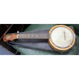 A KEECH BANJOLELE 55cm wide in a fitted case