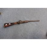 AN ANTIQUE PERCUSSION CAP SINGLE BARREL SMOOTH BORE GUN with walnut stock approximately 91cm long