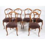 A SET OF SIX VICTORIAN LOOP BACK CARVED WALNUT DINING CHAIRS with upholstered seats (6)