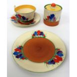 A SMALL QUANTITY OF CLARICE CLIFF CROCUS PATTERN BIZARRE WARE POTTERY consisting of a cup and