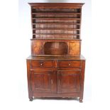 AN OLD FRENCH CHESTNUT DRESSER, the upper section with plate racks and central recess flanked by