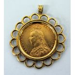 A VICTORIAN SOVEREIGN dated 1892 with a 9ct gold mount